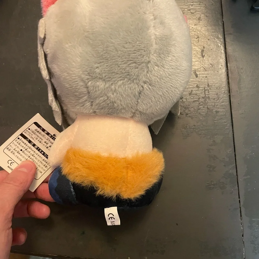 Gray and Pink Plush Toy with Blue Eyes